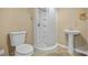 Bathroom featuring a stand-up shower, toilet, and basin sink at 411 Scarlet Sage, Punta Gorda, FL 33955