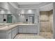 Bathroom features double sinks with lots of counterspace and walk in shower with tile surround at 411 Scarlet Sage, Punta Gorda, FL 33955