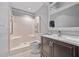 Bathroom includes a walk-in shower, vanity with a sink, and accessibility features at 411 Scarlet Sage, Punta Gorda, FL 33955