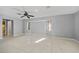 Spacious bedroom with neutral paint, ceiling fan, tile flooring and natural light at 411 Scarlet Sage, Punta Gorda, FL 33955