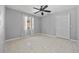 Bedroom with closet, window, ceiling fan and tile flooring offers a serene retreat at 411 Scarlet Sage, Punta Gorda, FL 33955