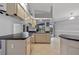 Well-appointed kitchen featuring modern appliances, sleek countertops, and ample cabinet space with views of the backyard at 411 Scarlet Sage, Punta Gorda, FL 33955