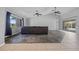 Spacious living room featuring high ceilings, large windows, and sliding glass doors for ample natural light and scenic views at 411 Scarlet Sage, Punta Gorda, FL 33955