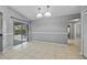 Bright living room boasts vaulted ceilings and sliding glass doors to outdoor pool area at 411 Scarlet Sage, Punta Gorda, FL 33955