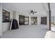 Spacious covered patio with fan and sliding glass doors offers outdoor living space at 411 Scarlet Sage, Punta Gorda, FL 33955