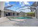 Enjoy this lovely screened in pool with brick trim and a spacious lanai at 411 Scarlet Sage, Punta Gorda, FL 33955