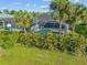 Overhead view of screened pool and home exterior at 411 Scarlet Sage, Punta Gorda, FL 33955
