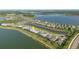 Aerial view of waterfront community featuring stunning lake views and single Gathering homes at 42346 Waterfront Way, Punta Gorda, FL 33982