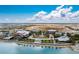 Breathtaking aerial perspective of the community, pool, lakefront, and surrounding landscape at 42346 Waterfront Way, Punta Gorda, FL 33982