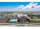 High-angle view featuring the community pool, recreational area, and pristine lake at 42346 Waterfront Way, Punta Gorda, FL 33982
