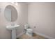 Powder room with a pedestal sink, tile floor, and neutral wall color at 42346 Waterfront Way, Punta Gorda, FL 33982