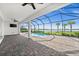Spacious covered patio with brick pavers, ceiling fans, and serene water view at 42346 Waterfront Way, Punta Gorda, FL 33982
