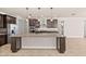Open kitchen with stainless steel appliances, granite counters, large island, and modern fixtures at 42346 Waterfront Way, Punta Gorda, FL 33982