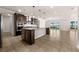 Open concept kitchen with large island, stainless steel appliances, and a clear view of the water at 42346 Waterfront Way, Punta Gorda, FL 33982