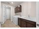 Laundry room with cabinets, counter space, utility sink, and front load washer and dryer at 42346 Waterfront Way, Punta Gorda, FL 33982