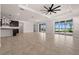 Open-concept living room with easy access to the gourmet kitchen and screened in pool area at 42346 Waterfront Way, Punta Gorda, FL 33982