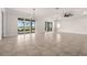 Bright living room with large sliding glass doors offering views of the pool and backyard at 42346 Waterfront Way, Punta Gorda, FL 33982