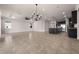 Open-concept living room boasts tile floors, modern lighting, and views into the gourmet kitchen at 42346 Waterfront Way, Punta Gorda, FL 33982