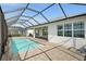 A view of the pool with brick pavers surrounding the outdoor area and part of the exterior at 42346 Waterfront Way, Punta Gorda, FL 33982