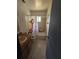 Bathroom with wood vanity, single sink, toilet and bathtub with tile surround and a shower curtain at 4424 Baroda Ave, North Port, FL 34287