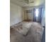 Bedroom featuring neutral walls, ceiling fan, window with curtains and bi-fold closet doors at 4424 Baroda Ave, North Port, FL 34287