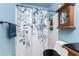 Bathroom featuring floral shower curtain and modern towel rack at 4583 S Salford Blvd, North Port, FL 34287