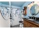 Bathroom featuring a vanity and a shower with a blue floral curtain at 4583 S Salford Blvd, North Port, FL 34287