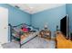 Bedroom with a dark metal bed frame and cozy decor at 4583 S Salford Blvd, North Port, FL 34287