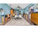 Bright dining room with table, area rug, fan, and view to outdoor area at 4583 S Salford Blvd, North Port, FL 34287