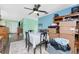 Bright dining room featuring a ceiling fan, table, and natural light at 4583 S Salford Blvd, North Port, FL 34287