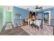 Inviting dining room with hardwood floors and sliding doors to the backyard at 4583 S Salford Blvd, North Port, FL 34287