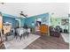 Bright dining room with wood-look floors, abundant natural light, and flexible space at 4583 S Salford Blvd, North Port, FL 34287