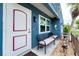 Inviting front entrance featuring bench seating and charming decor at 4583 S Salford Blvd, North Port, FL 34287