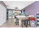 Well-lit kitchen boasts an island with bar seating, abundant counter space, and modern appliances for culinary enthusiasts at 4583 S Salford Blvd, North Port, FL 34287