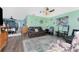 Cozy living room featuring comfortable seating, ceiling fans, and hardwood floors at 4583 S Salford Blvd, North Port, FL 34287