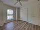 Bedroom with modern vinyl flooring, a window, and a double-door closet at 4609 Jaslo Ave, North Port, FL 34286
