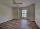 Bedroom with a window, built-in closet and modern vinyl flooring at 4609 Jaslo Ave, North Port, FL 34286