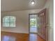 Welcoming entryway showcasing wood flooring, a large window, and an open doorway to the front yard at 4609 Jaslo Ave, North Port, FL 34286