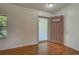 Bright entryway featuring wood floors, a glass door that brings in natural light, and neutral wall colors at 4609 Jaslo Ave, North Port, FL 34286