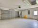 Spacious two-car garage with an automatic door, utility door and high ceilings at 4609 Jaslo Ave, North Port, FL 34286