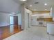 Open floor plan featuring a kitchen with white appliances and adjacent living area at 4609 Jaslo Ave, North Port, FL 34286