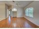 Spacious living room with vaulted ceilings, a large window, and attractive wood floors, offering lots of light at 4609 Jaslo Ave, North Port, FL 34286