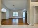 Spacious living room with hardwood floors, natural light, and adjacent dining area at 4609 Jaslo Ave, North Port, FL 34286