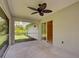 A covered patio with fan, offering an outdoor extension of the home's living space at 4609 Jaslo Ave, North Port, FL 34286
