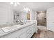 The bathroom offers double vanities, granite countertops and a glass-enclosed shower creating a spa-like retreat at 5436 Jessamine Ave, North Port, FL 34291