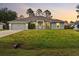 Charming single-story home featuring a well-manicured lawn and a welcoming front entrance at 5436 Jessamine Ave, North Port, FL 34291
