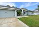 Beautiful single-story home featuring a well-manicured lawn and a welcoming front entrance at 5436 Jessamine Ave, North Port, FL 34291