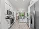 Beautiful modern kitchen, stainless appliances and large sink at 5436 Jessamine Ave, North Port, FL 34291
