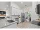 Well-lit kitchen with stainless steel appliances, granite counters and open view to other rooms at 5436 Jessamine Ave, North Port, FL 34291