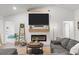 Cozy living room with fireplace, TV, and comfortable seating for a relaxing atmosphere at 5436 Jessamine Ave, North Port, FL 34291